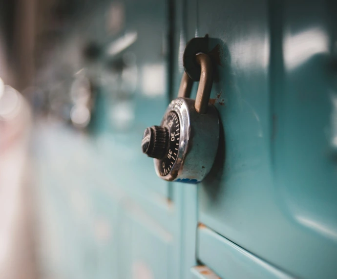 selective focus photography of gray metal padlock